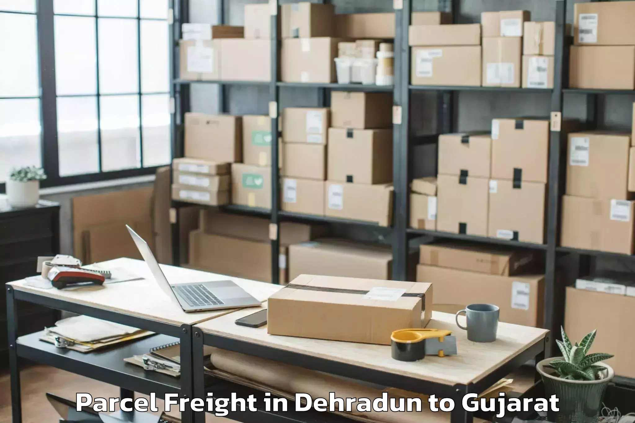 Leading Dehradun to Savar Kundla Parcel Freight Provider